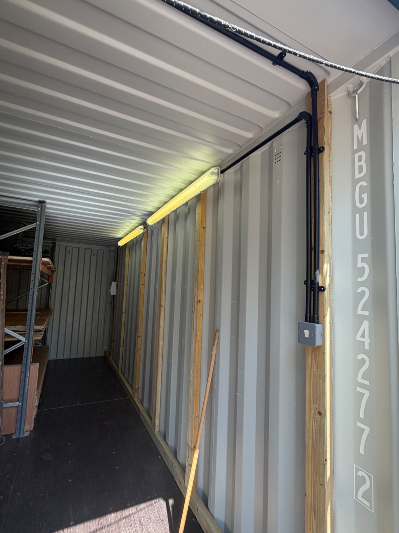 Industrial container lighting, containment and switched power installation